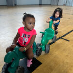 toddler on bike in gym